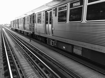 Train moving against clear sky