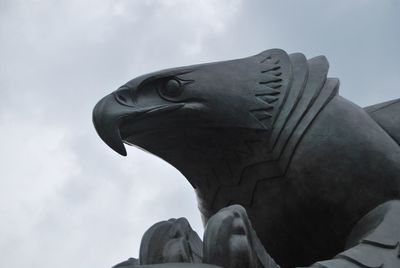 Low angle view of statue against sky