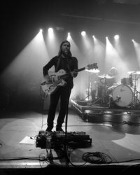 Man playing at music concert