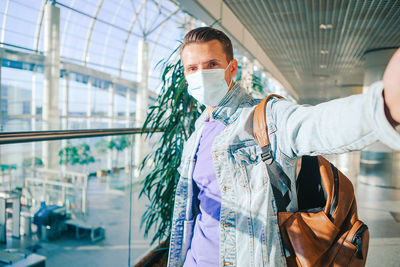 Midsection of man standing by bus