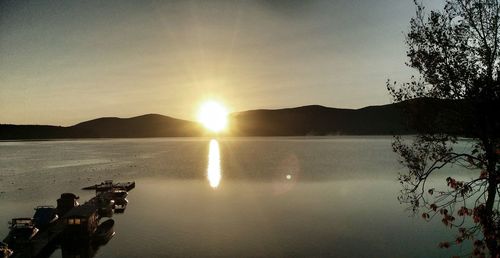 Scenic view of lake against sky during sunset