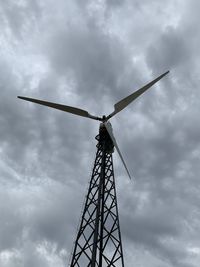 Low angle view of windmill against sky