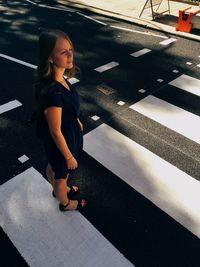 Woman standing on road