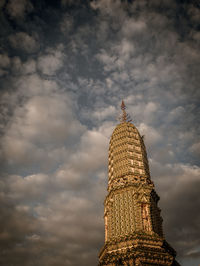 Low angle view of historical building against cloudy sky