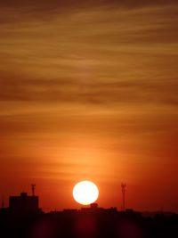 Low angle view of silhouette building against sky during sunset