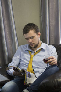 Young man sitting at home