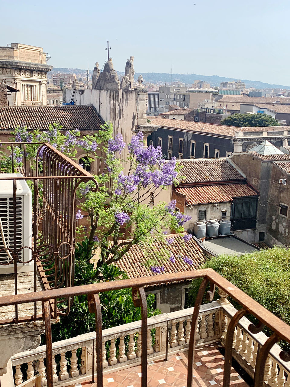 architecture, built structure, building exterior, nature, city, building, plant, travel destinations, flower, flowering plant, sky, no people, day, vacation, estate, travel, residential district, outdoors, tourism, high angle view, cityscape, urban area, railing, sunny, neighbourhood, clear sky, garden