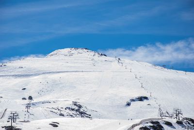 Scenic view of snow covered mountain against sky