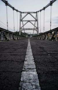 Surface level of road against bridge in city