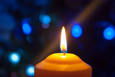 Close-up of illuminated candle