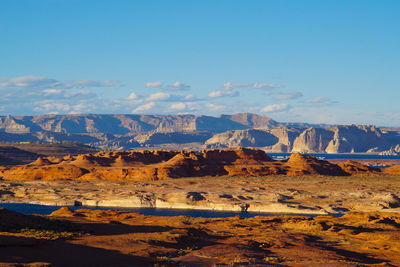 Scenic view of landscape against blue sky