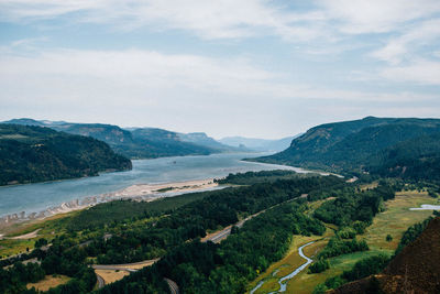 Scenic view of landscape and mountains against sky