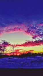 Scenic view of dramatic sky over sea during sunset