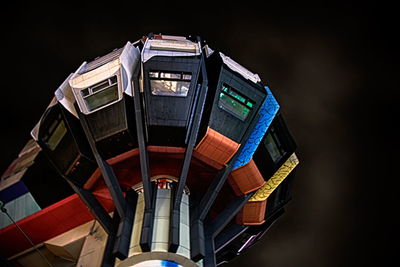 Low angle view of illuminated building against sky at night