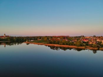 Scenic view of lake against clear blue sky