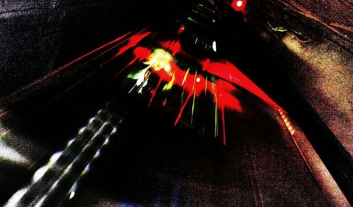 Low angle view of illuminated car against sky at night