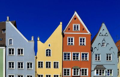 Residential buildings against blue sky