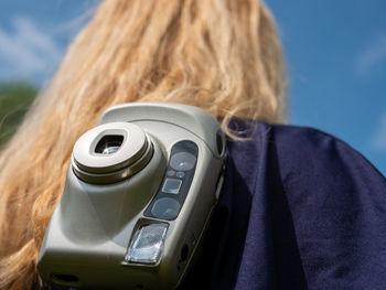 Rear view of woman using mobile phone