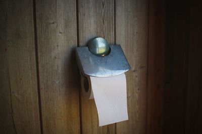 High angle view of old door handle on wall