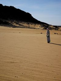 Full length of man standing in desert