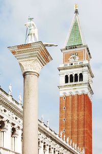 Low angle view of bell tower against sky