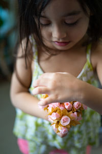 Small flower bouquet being hold by a toddler.