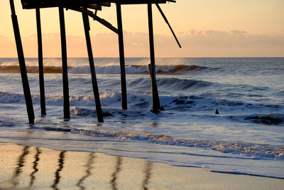 Scenic view of sea against sky at sunset