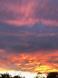 Low angle view of dramatic sky during sunset