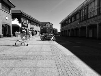 Cars on street amidst buildings in city