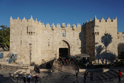 Group of people in front of historical building