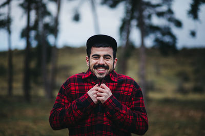 Portrait of young man standing outdoors