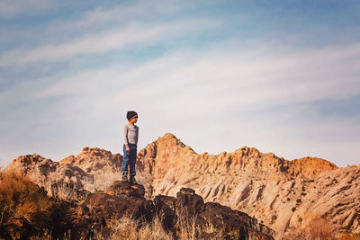 Small boy standing on top of a mountain in state park