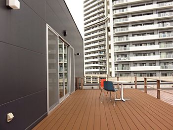 Cafe on terrace against buildings in city