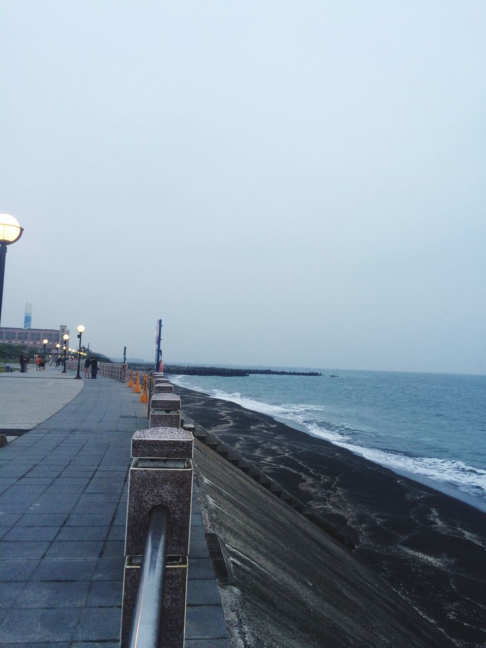 sea, clear sky, horizon over water, copy space, water, beach, built structure, tranquility, tranquil scene, nature, scenics, shore, pier, transportation, the way forward, day, beauty in nature, incidental people, outdoors, architecture