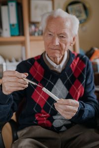 Portrait of man sitting at home