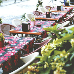 Empty chairs and tables at outdoor cafe