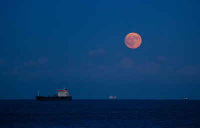 Scenic view of sea against sky at night