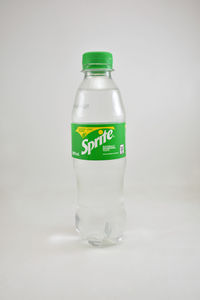 Close-up of glass bottle against white background