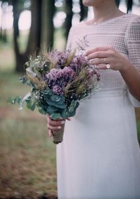 Close-up of woman holding bouquet