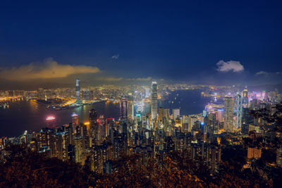 High angle view of illuminated city buildings at night