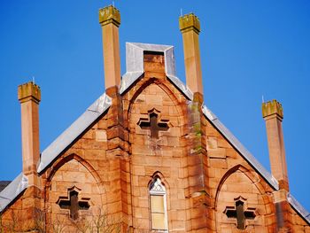 Low angle view of bell tower against sky