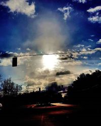 Road against cloudy sky at sunset