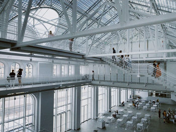 People walking in building interior 