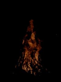 Close-up of bonfire against black background