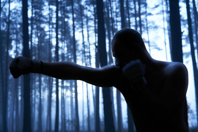 Woman standing in a forest