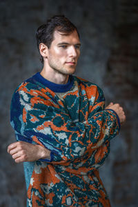 Portrait of young man standing outdoors