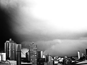 City skyline against cloudy sky