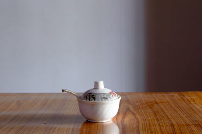 Close-up of tea cup on table