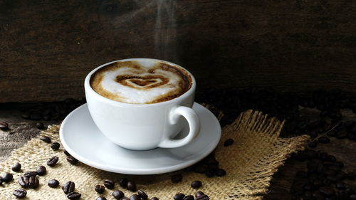 Close-up of cappuccino on table