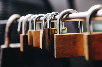 Close-up of padlocks on railing